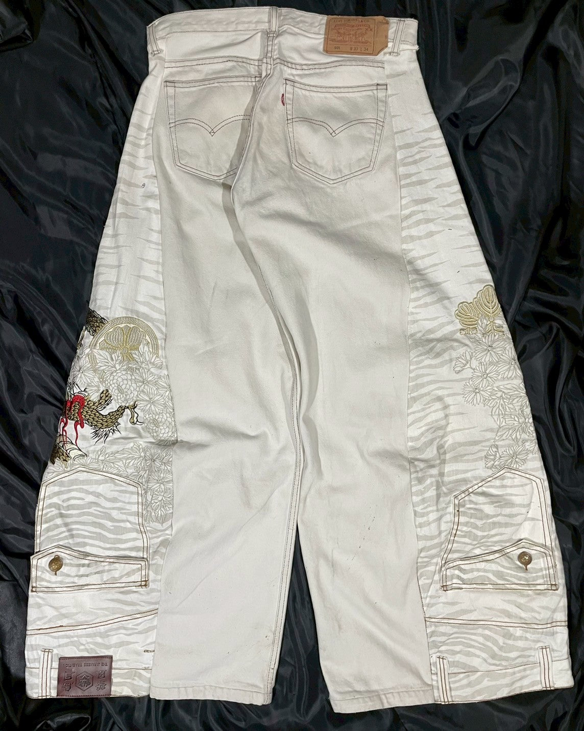 Custom jeans with tiger and dragon embroidery design