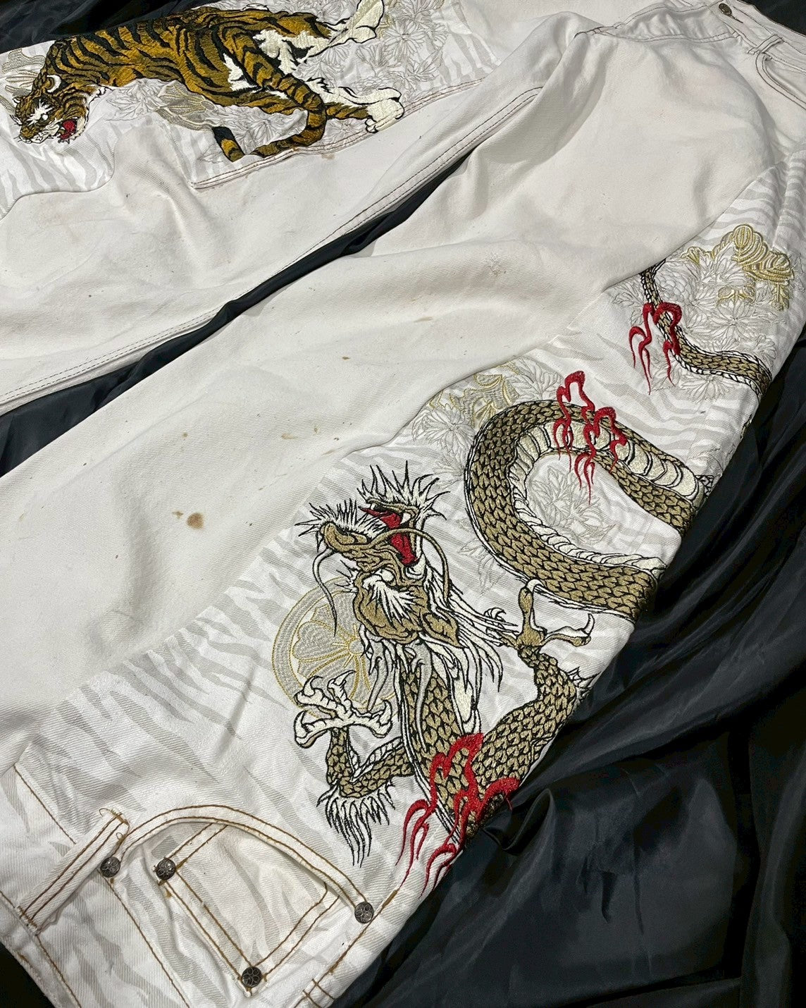 Custom jeans with tiger and dragon embroidery design