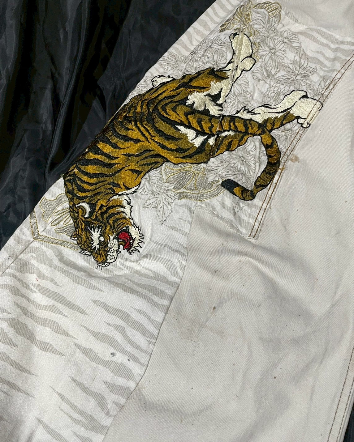 Custom jeans with tiger and dragon embroidery design